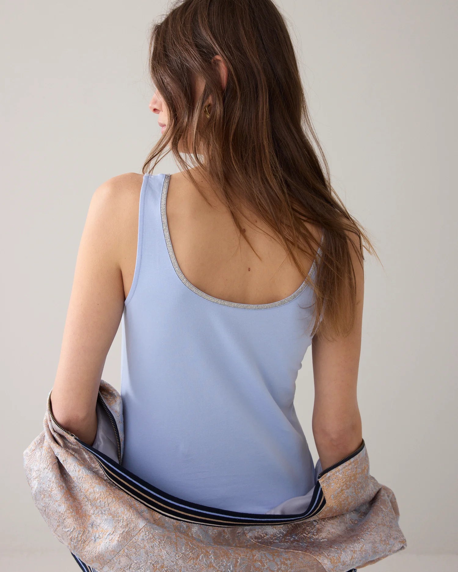 Summum Reversible singlet with glitter trim