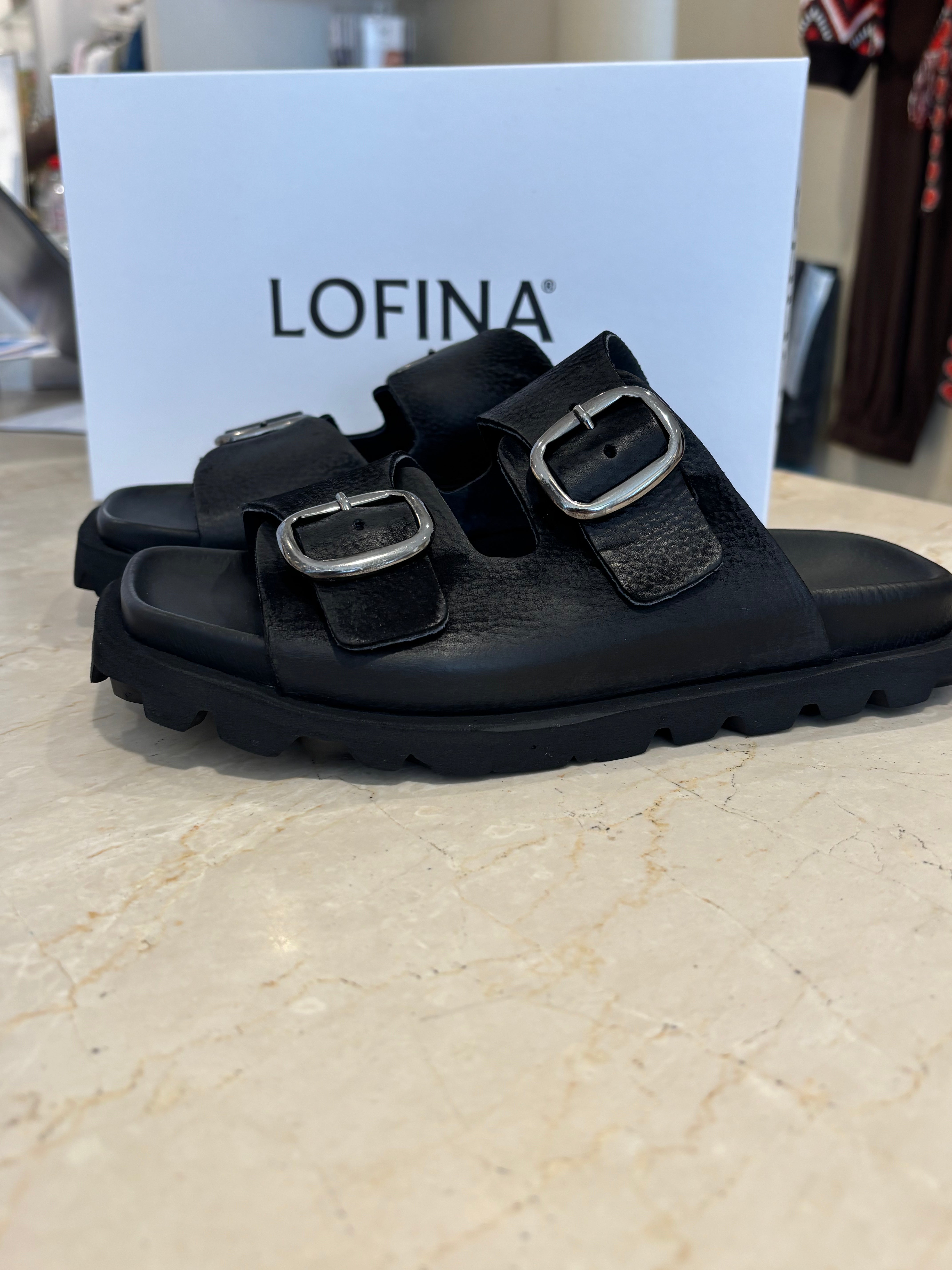 Lofina Sandal with buckles and a footbed sole