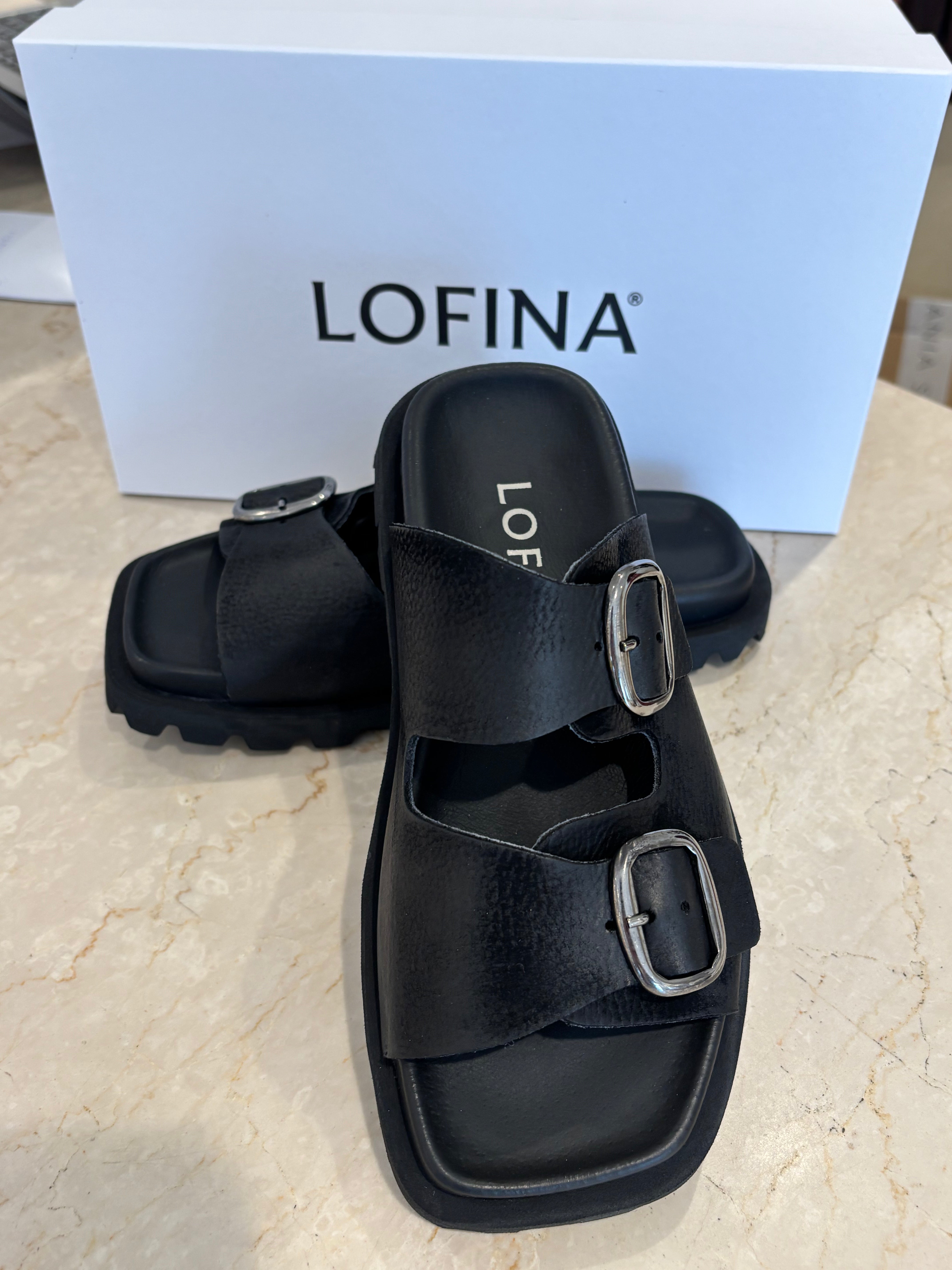 Lofina Sandal with buckles and a footbed sole